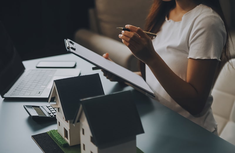 trust_0000_real-estate-agent-delivering-sample-homes-customers-mortgage-loan-contracts-make-contract-hire-purchase-sale–min